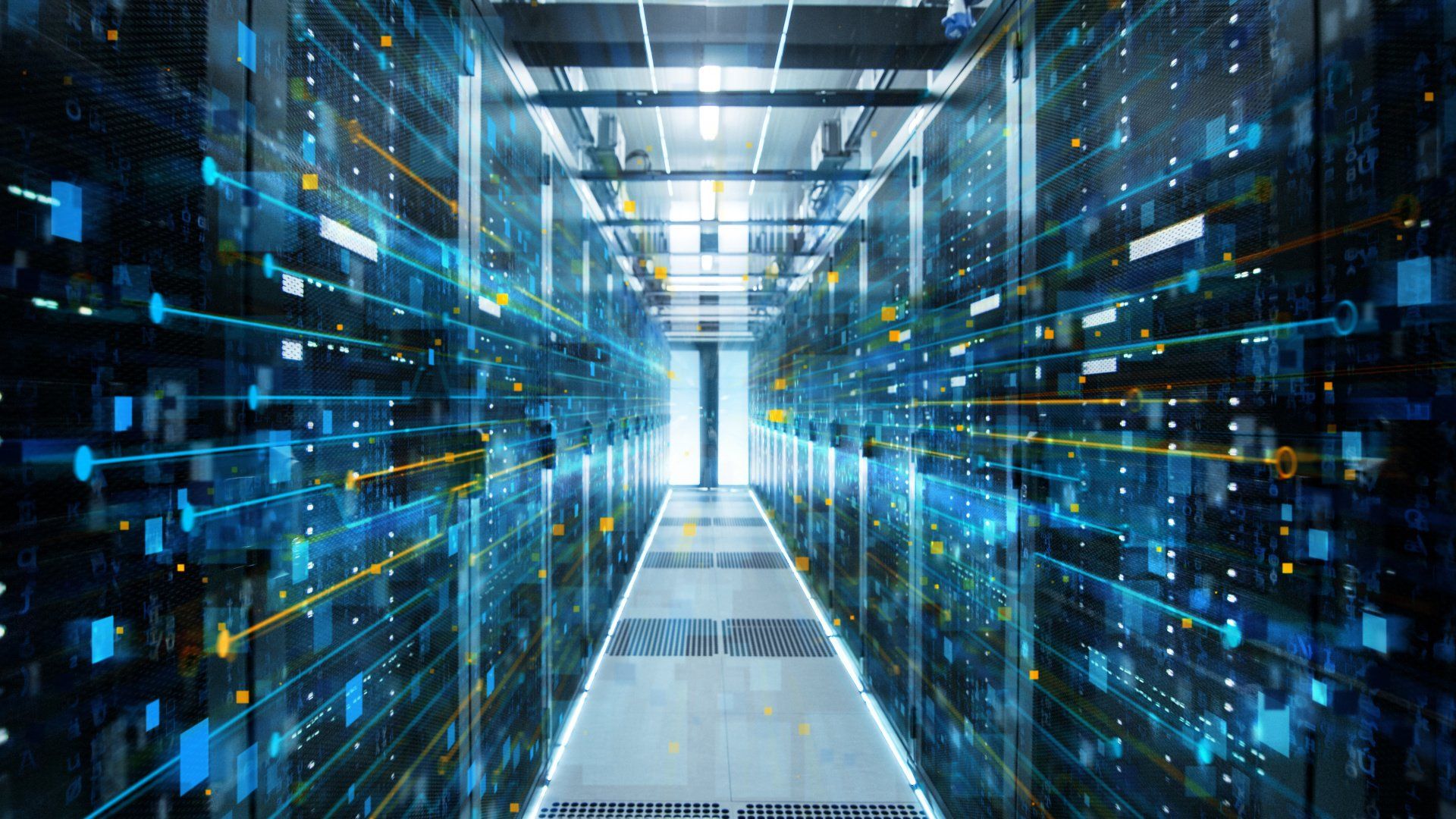 A hallway filled with lots of servers in a data center.