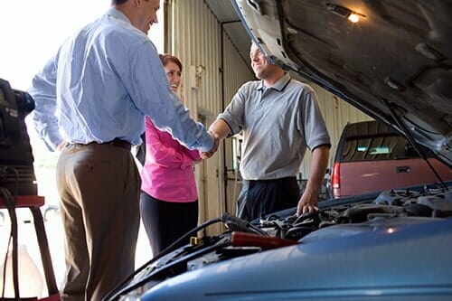 Shaking hands with auto mechanic - vehicle service in Tampa FL Shaking hands with auto mechanic - vehicle service in Tampa FL