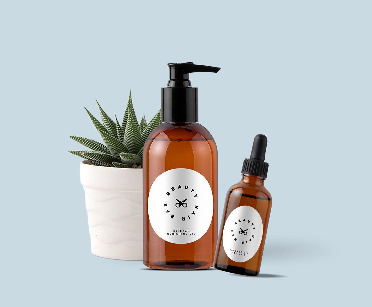 A bottle of lotion and a dropper next to a potted plant.
