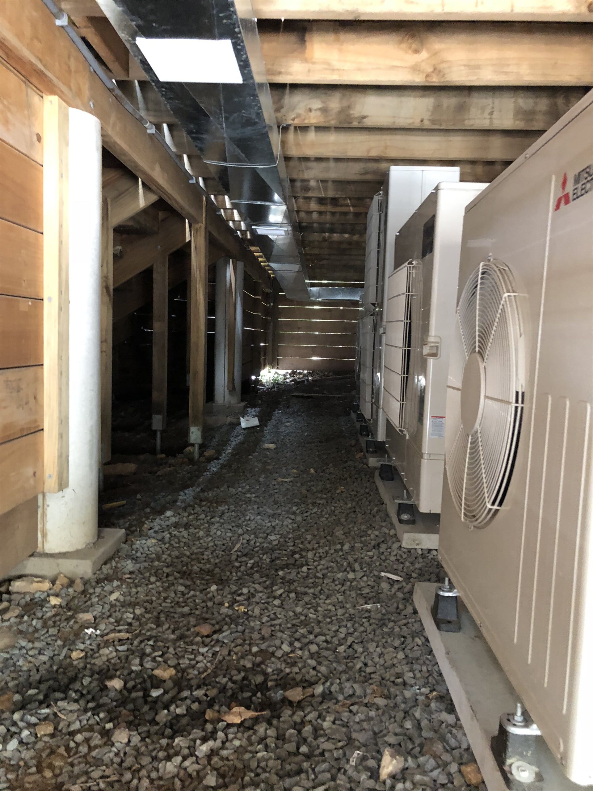 Man Working Aircondition — Residential & Commercial Airconditioning Repair in Batemans Bay, NSW