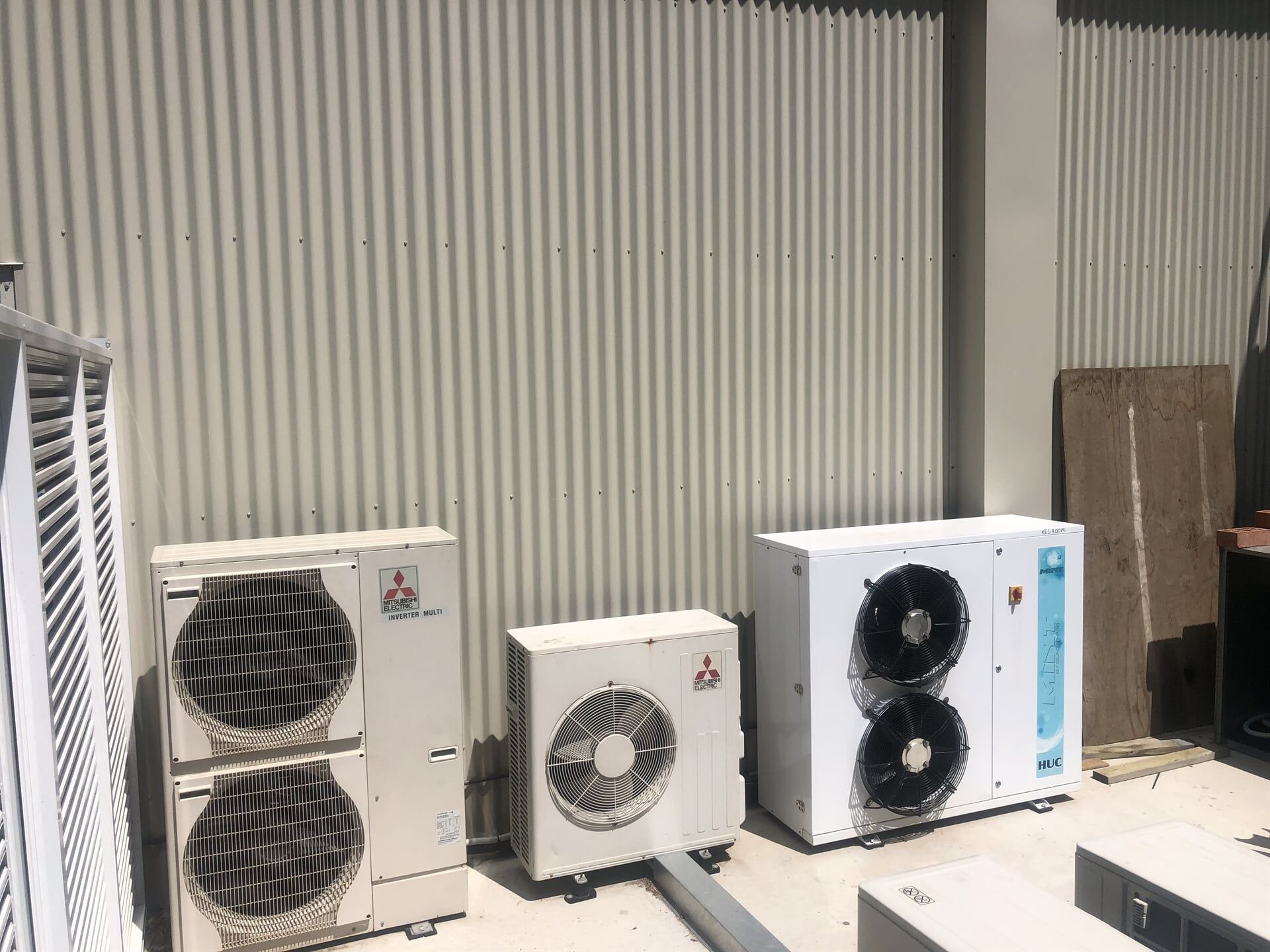 Man repairing VRF — Residential & Commercial Airconditioning Repair in Batemans Bay, NSW