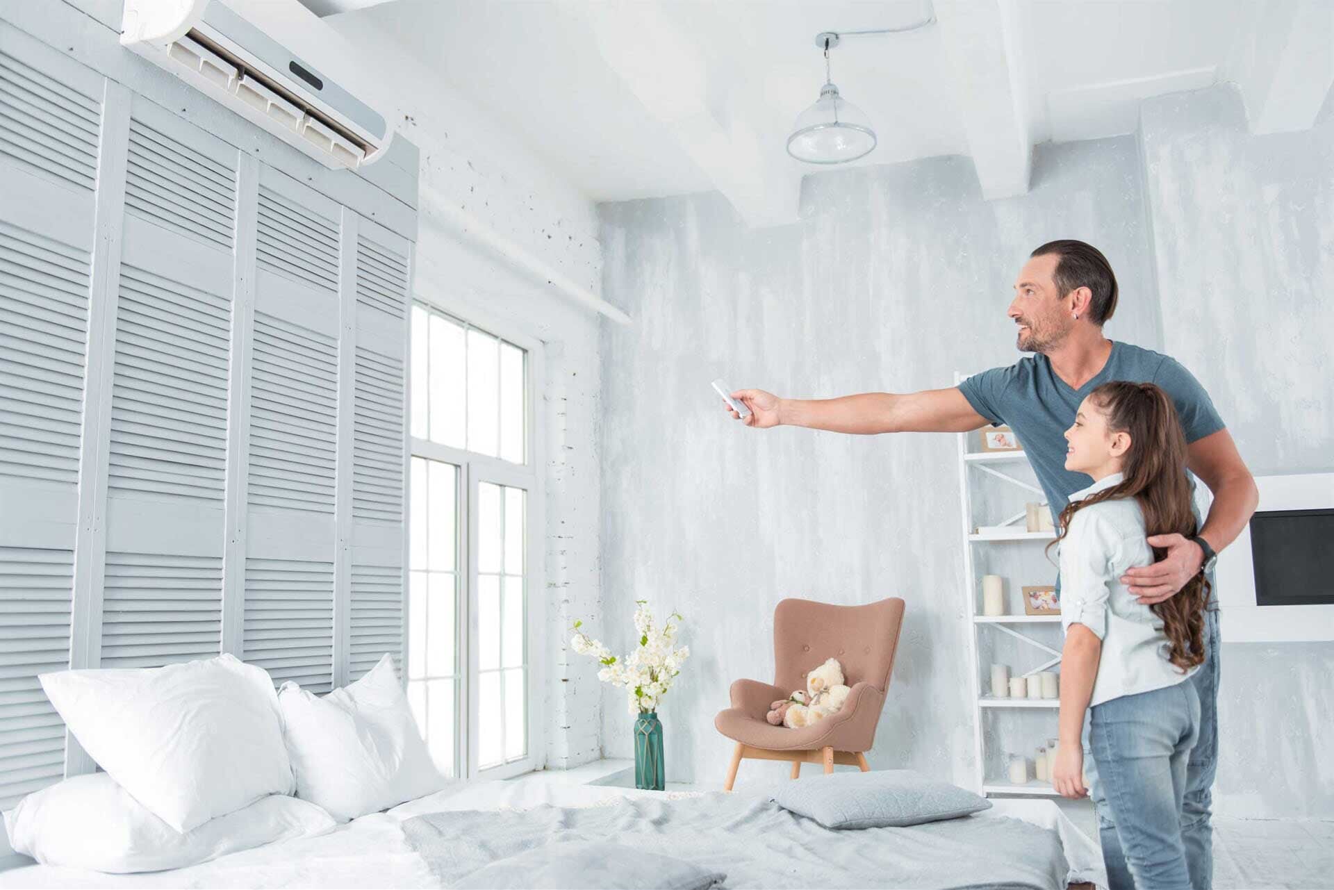 Man operating Air Condition — Residential & Commercial Airconditioning Repair in Batemans Bay, NSW Man operating Air Condition — Residential & Commercial Airconditioning Repair in Batemans Bay, NSW