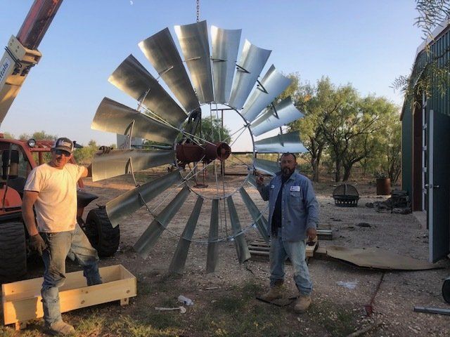 2 workers with windmill