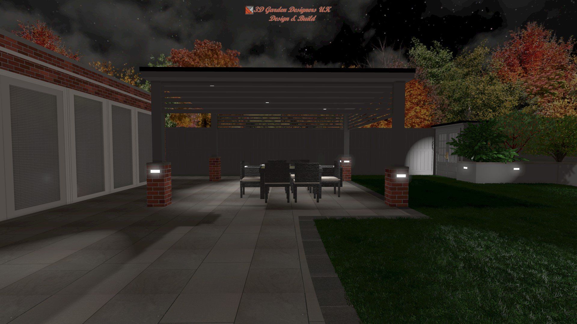A patio area with a table and chairs under a pergola at night.