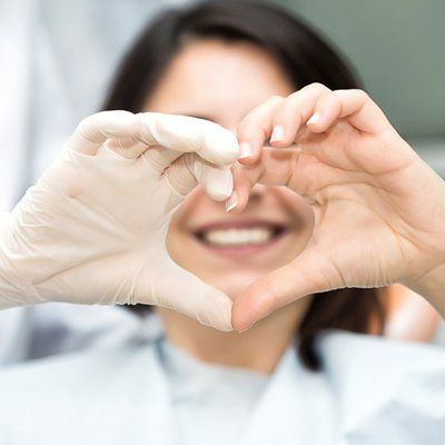 Teeth Whitening — Heart Hand Sign in Modesto, CA Teeth Whitening — Heart Hand Sign in Modesto, CA