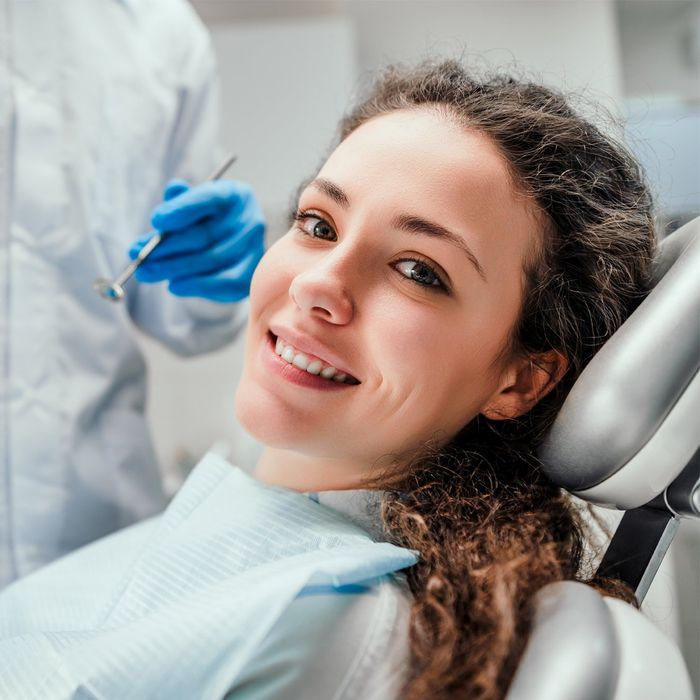 Happy Young Woman Having Dental Checkup — Katy, Texas — Katy Dental Studio Happy Young Woman Having Dental Checkup — Katy, Texas — Katy Dental Studio