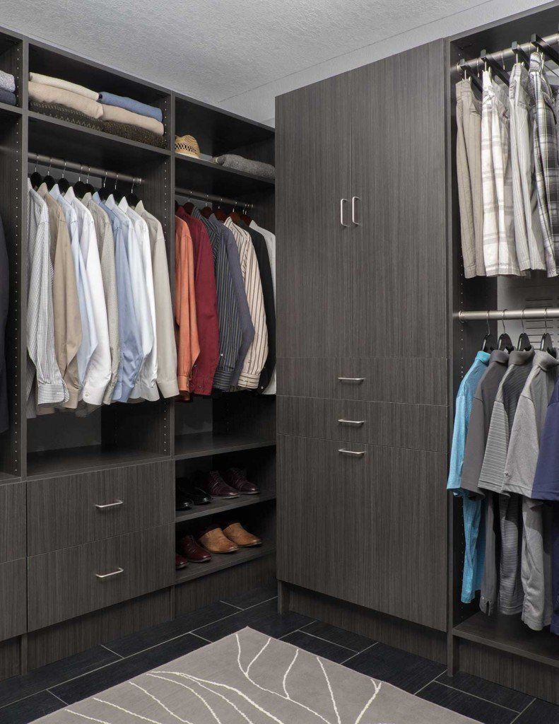 A walk in closet filled with clothes and shoes