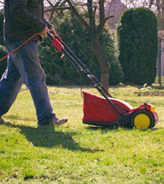 Man with Verticutter in the Garden — Lawn Moving in Janesville, WI