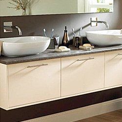 2 bathroom sinks with accessories