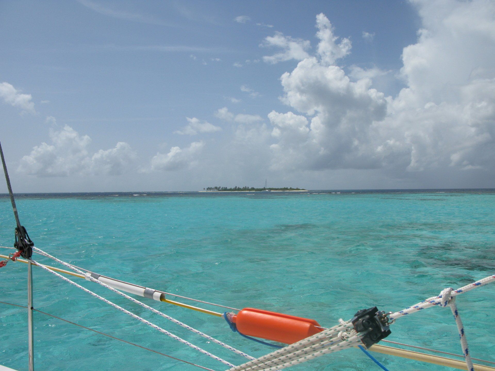 A large body of water with a small island in the distance