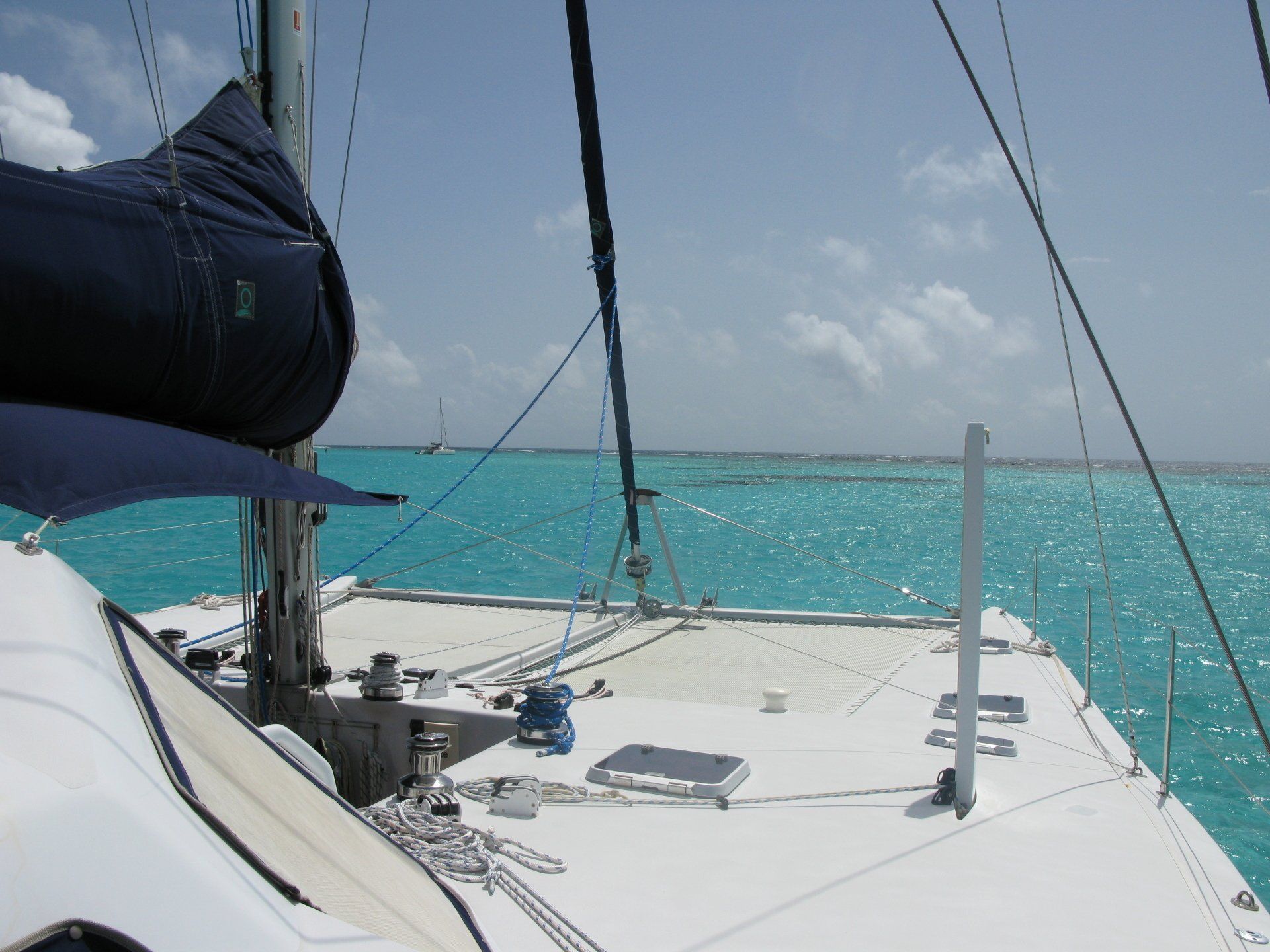 A sailboat floating on top of a body of water
