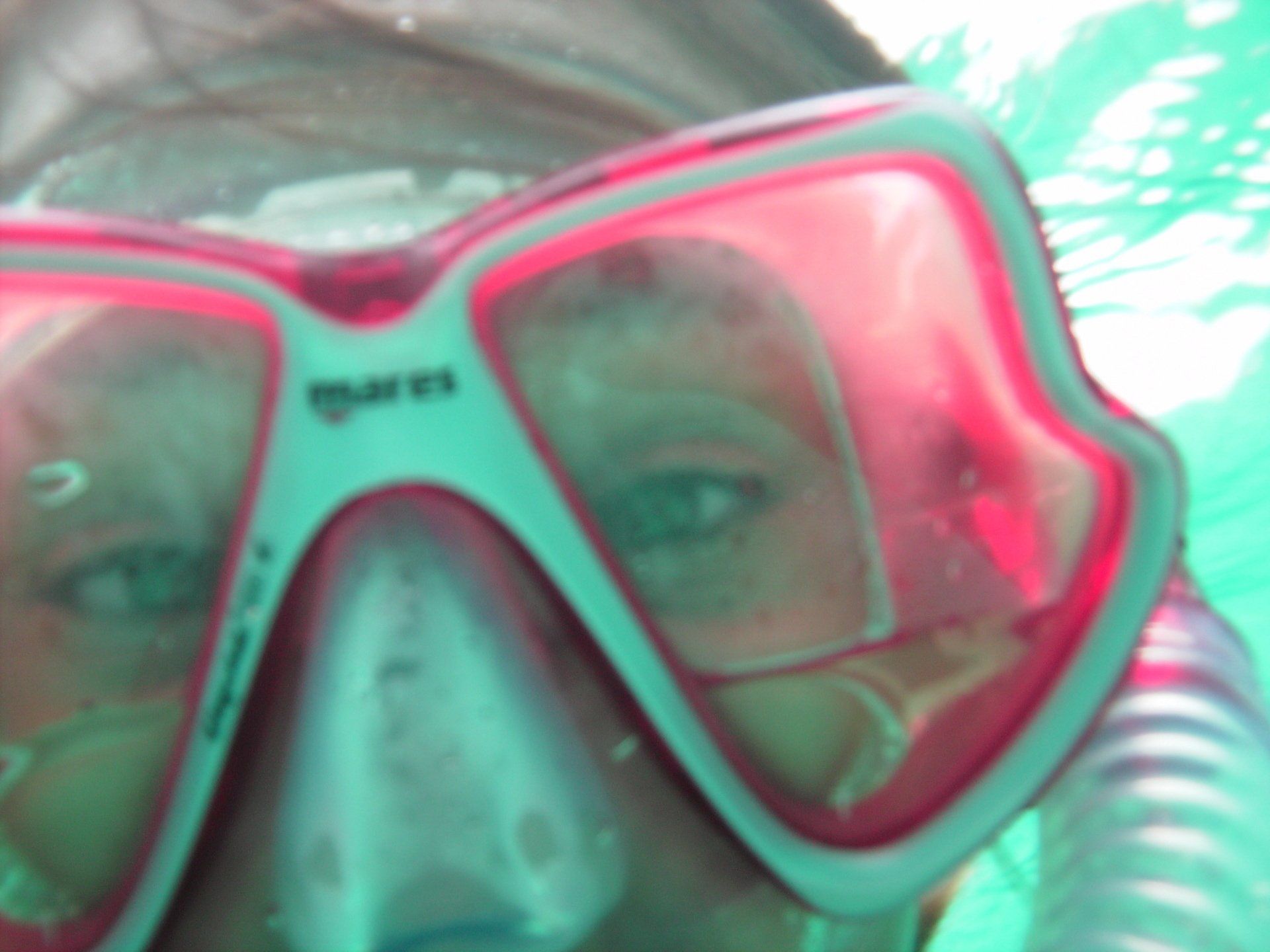 A close up of a person wearing a mask that says mares on it