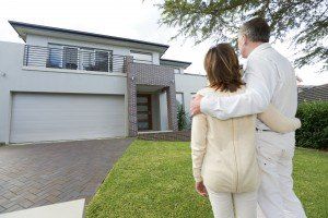 Mature couple looking at a house