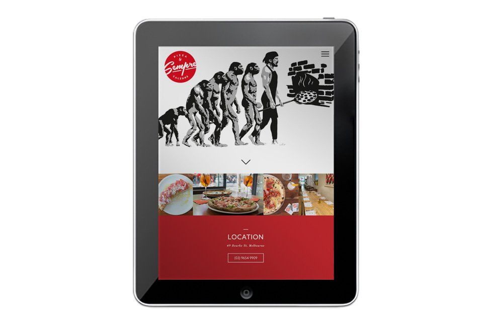 A tablet is displaying a website for a pizza restaurant.