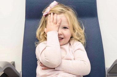 girl covering eye