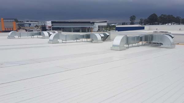 sheet metal ducts on commercial roof