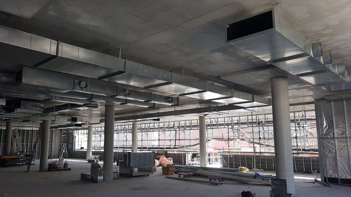 large metal ducting being installed