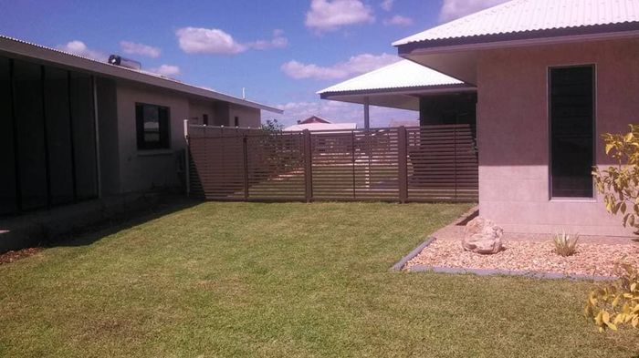 Brown slat gate — Gates Darwin in Pinelands, NT