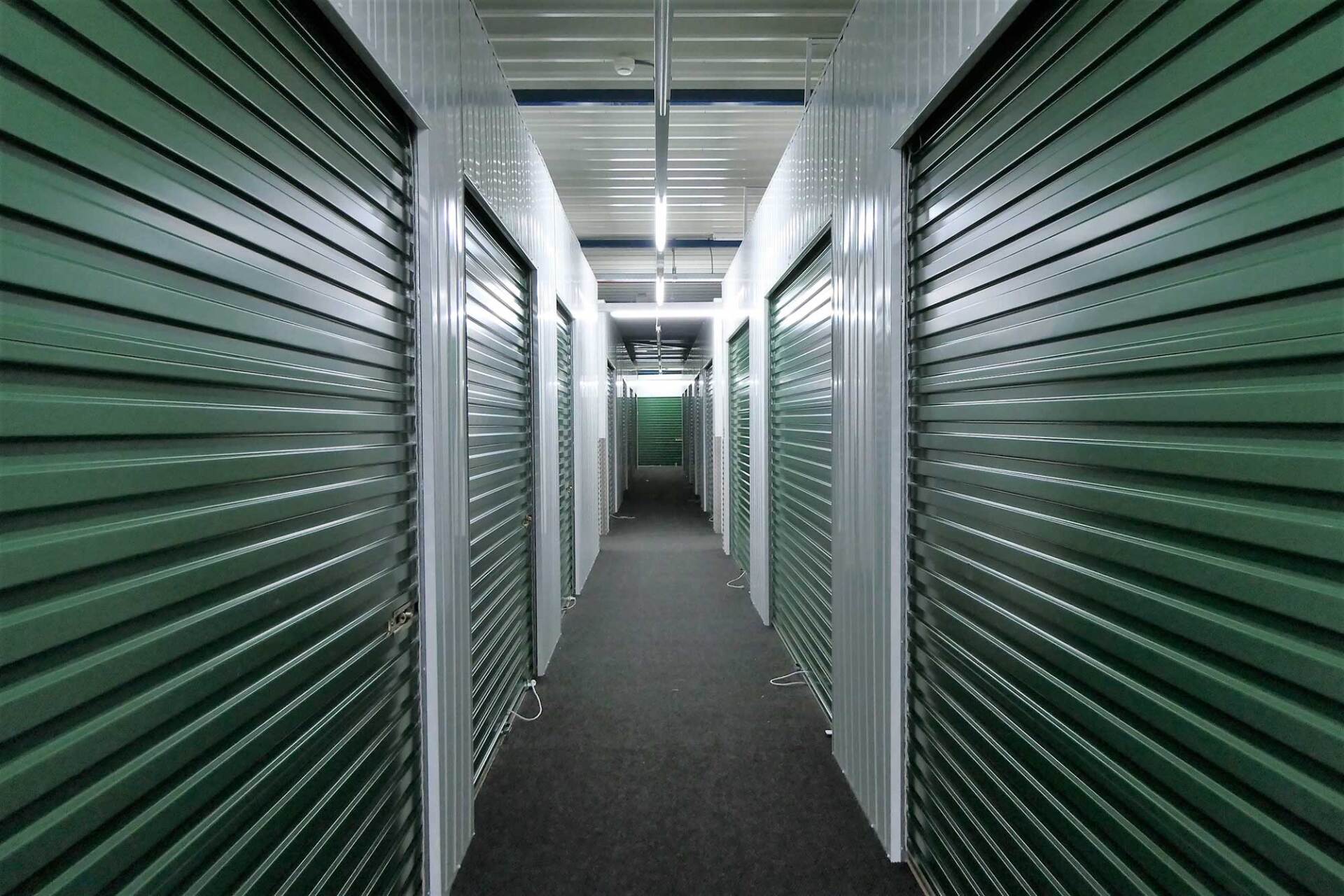 Self Storage with Green Rolling Doors — West Virginia — Watts Brothers Moving Self Storage with Green Rolling Doors — West Virginia — Watts Brothers Moving
