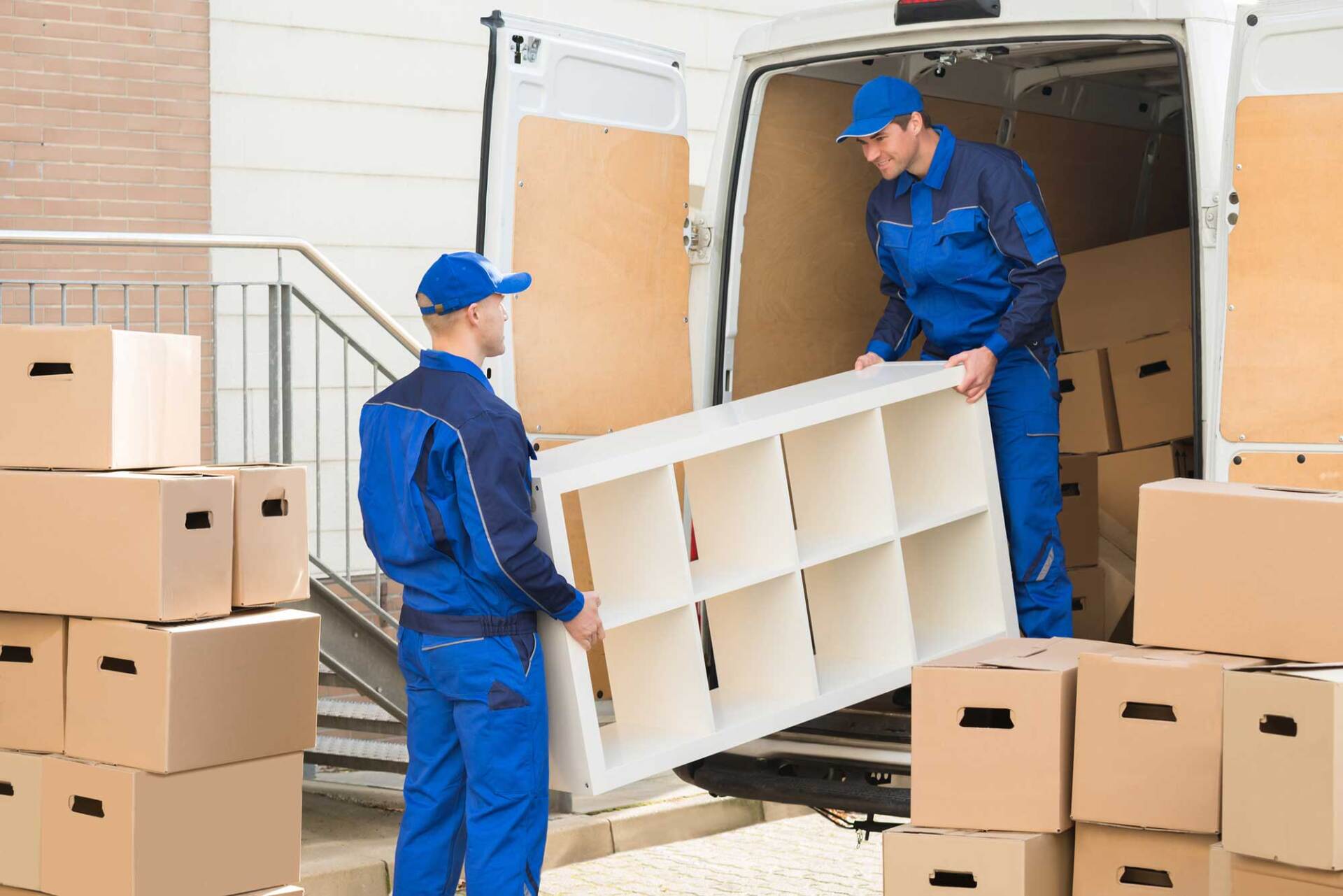 Movers Unloading Furniture and Cardboard Boxes — West Virginia — Watts Brothers Moving