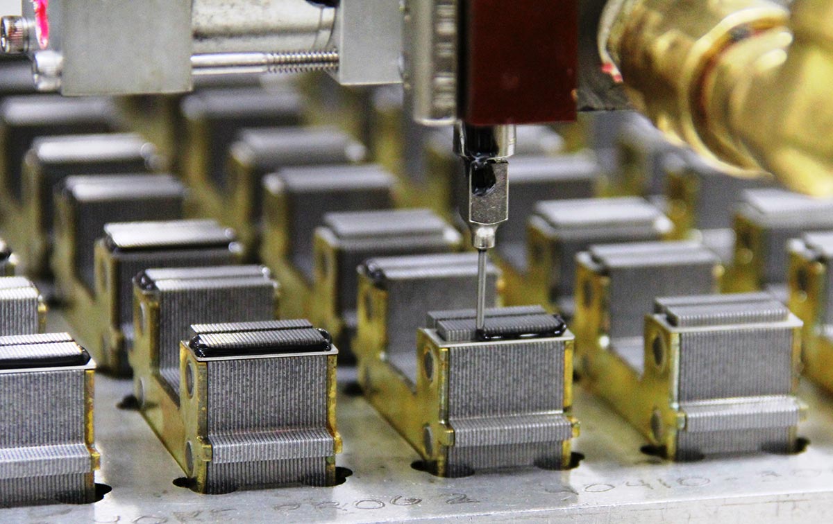 Automated Assembly of electrical steel laminations into riveted transformer cores
