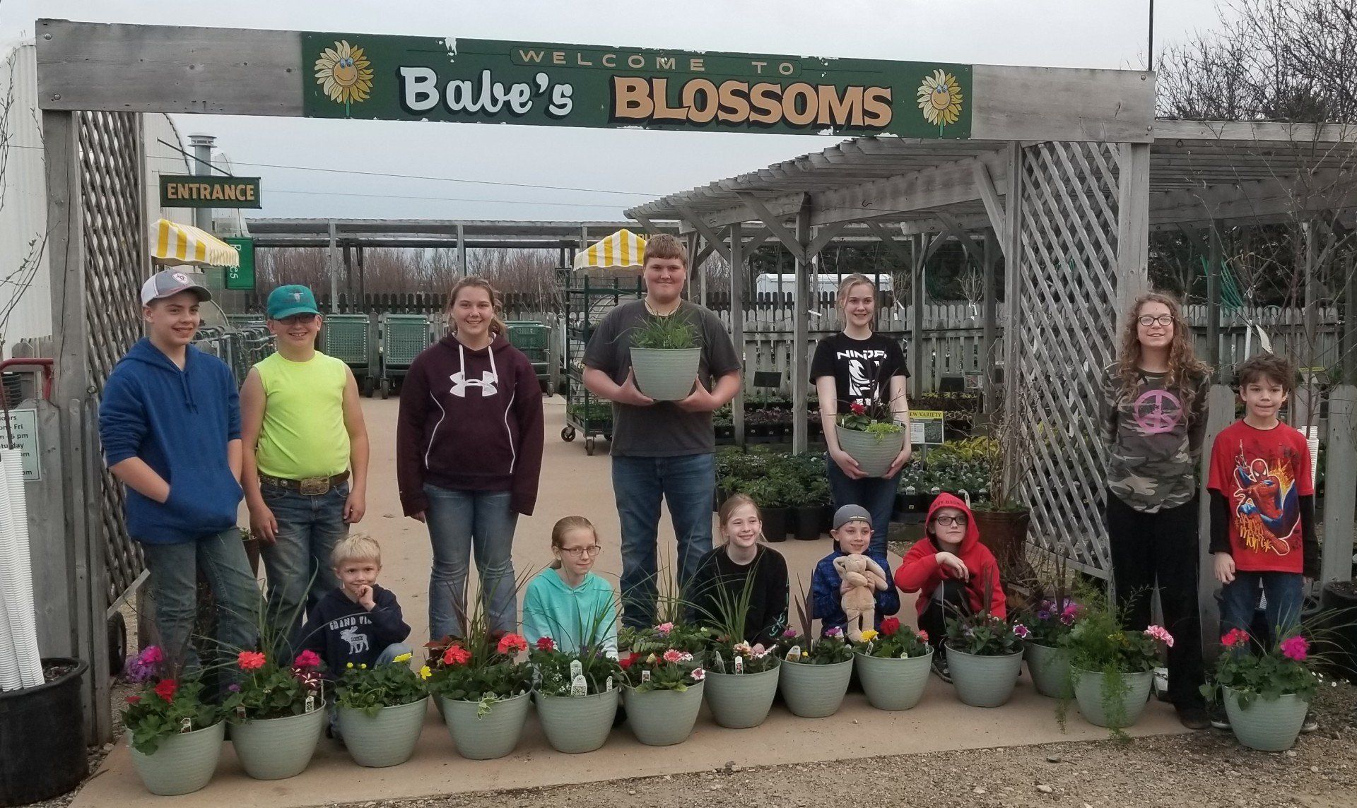 kids with planted containers