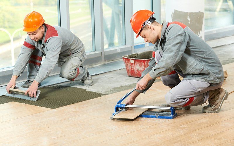 Workers Installing New Floor — San Diego, CA — Click On Floor Workers Installing New Floor — San Diego, CA — Click On Floor