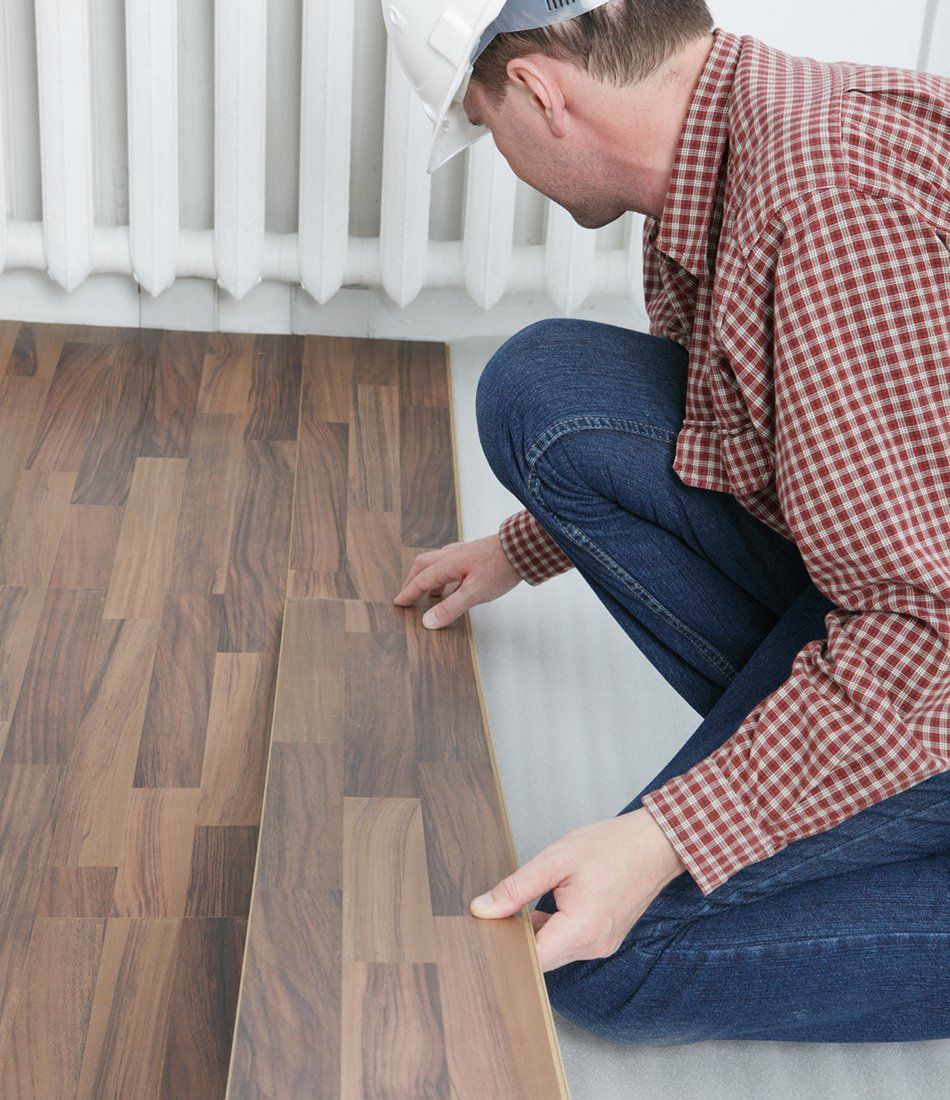 Man Placing Wood Planks — San Diego, CA — Click On Floors Man Placing Wood Planks — San Diego, CA — Click On Floors