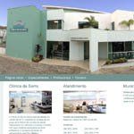 A large white and green building with a lot of windows is on a website.