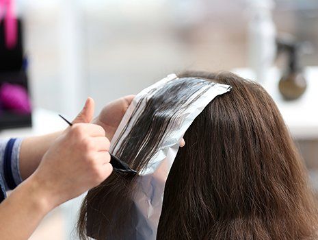 Hairdresser coloring hair Hairdresser coloring hair