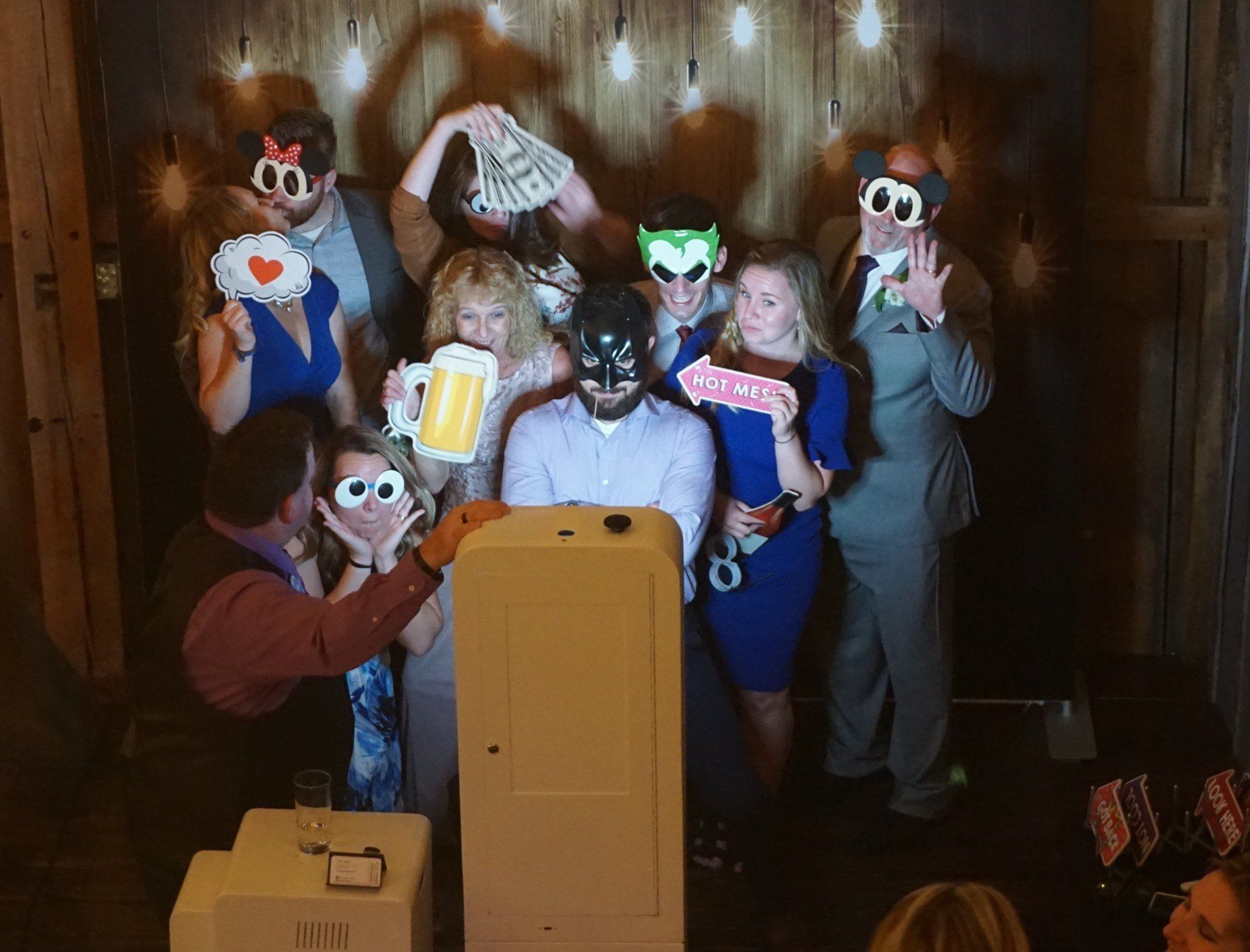 couple and guests making faces in photo booth rental