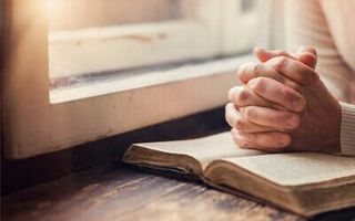 Senior praying — contact services in Parma, OH Senior praying — contact services in Parma, OH