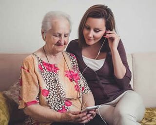 Senior listening to music — Skilled Nursing in Parma, OH Senior listening to music — Skilled Nursing in Parma, OH