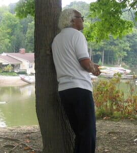 Senior beside a tree — Medication management in Parma, OH Senior beside a tree — Medication management in Parma, OH