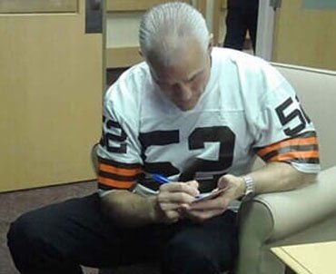 Man signing autographs — Medication management in Parma, OH Man signing autographs — Medication management in Parma, OH