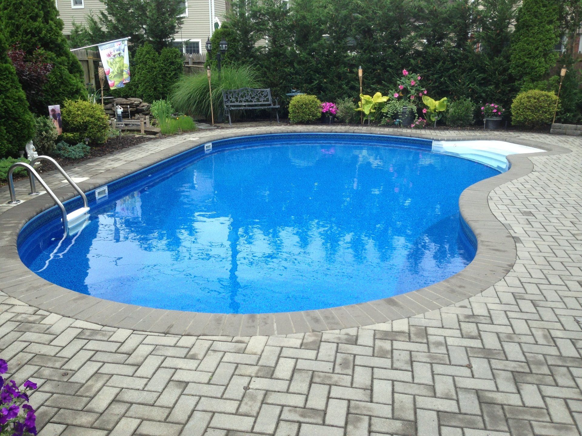 a swimming pool with a flag that says ' i love you ' on it