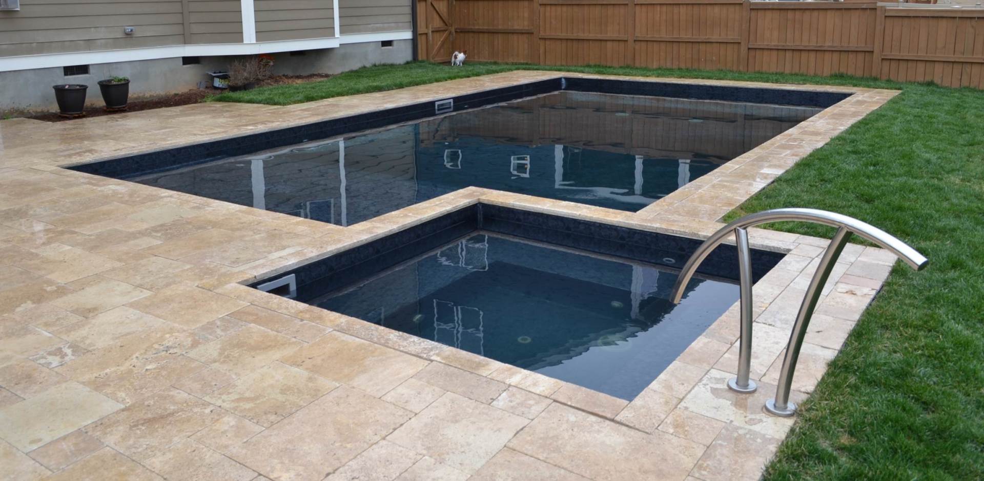 a swimming pool with a staircase leading to it