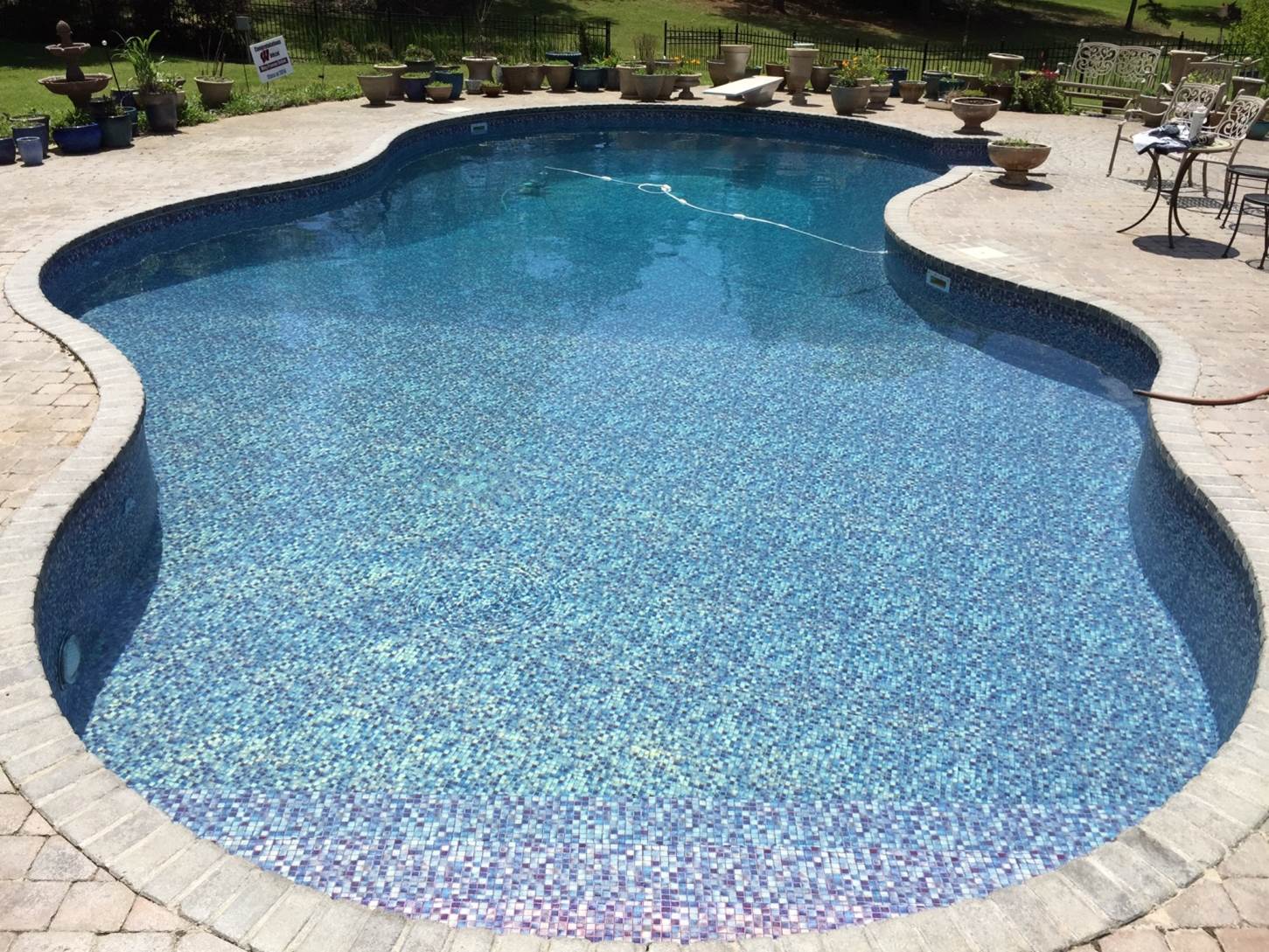 a large swimming pool with a sign that says ' swimming pool ' on it