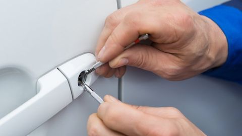 Lockpicker Opening Car Door — Saint Louis, MO — Krause Key & Lock Service Lockpicker Opening Car Door — Saint Louis, MO — Krause Key & Lock Service