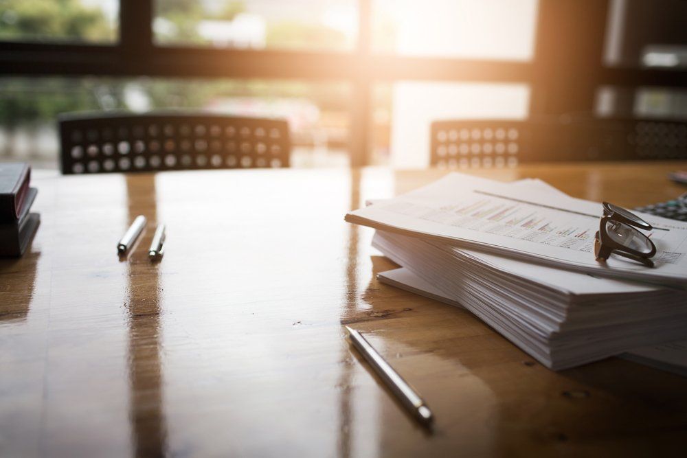 Attorney — Documents on Wooden Table in Miami Lakes, FL Attorney — Documents on Wooden Table in Miami Lakes, FL