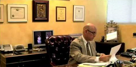 Attorney In Ft Lauderdale — Lawyer Reading Documents Inside An Office in Miami Lakes, FL Attorney In Ft Lauderdale — Lawyer Reading Documents Inside An Office in Miami Lakes, FL