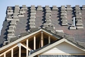 Stacks of tiles on roof – DSR Roofing & Protective Coatings in Yuma, AZ Stacks of tiles on roof – DSR Roofing & Protective Coatings in Yuma, AZ