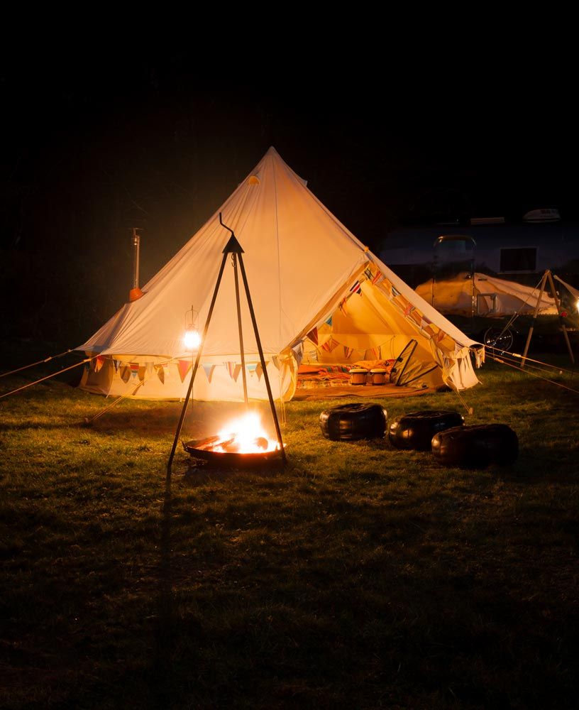 tent with cooking fire nearby
