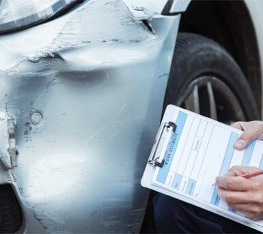 Inspecting Damage To Car — Car Maintenance in Kingsport, TN Inspecting Damage To Car — Car Maintenance in Kingsport, TN