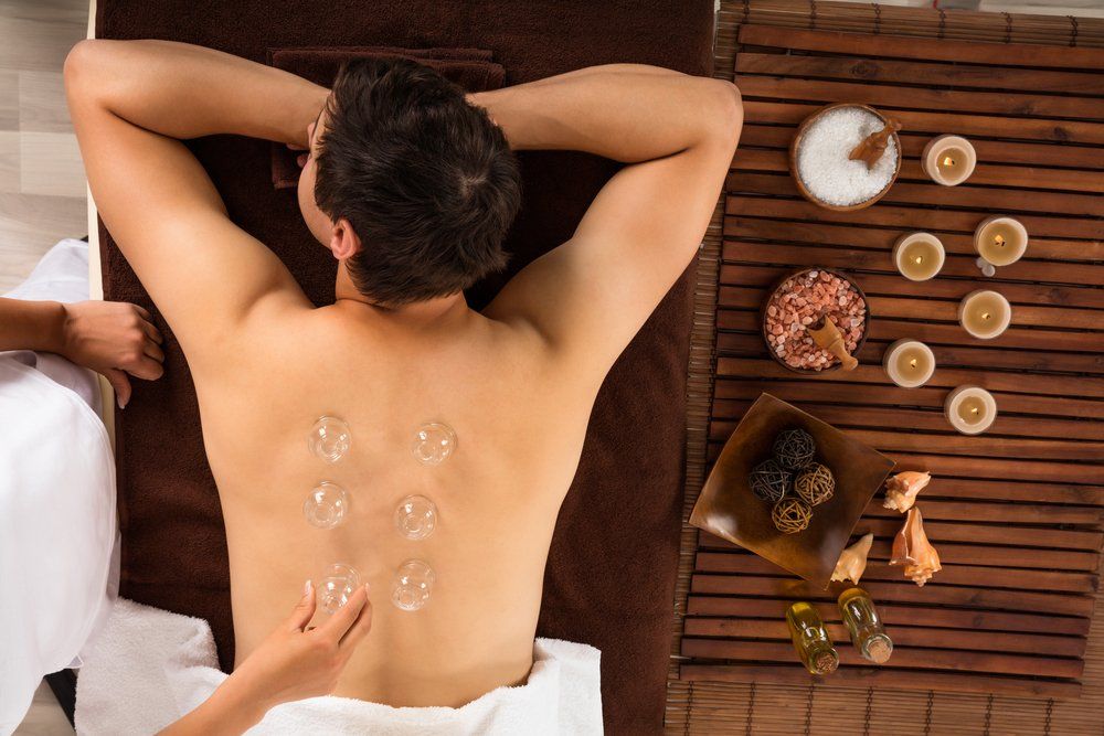 A man is getting a massage at a spa.