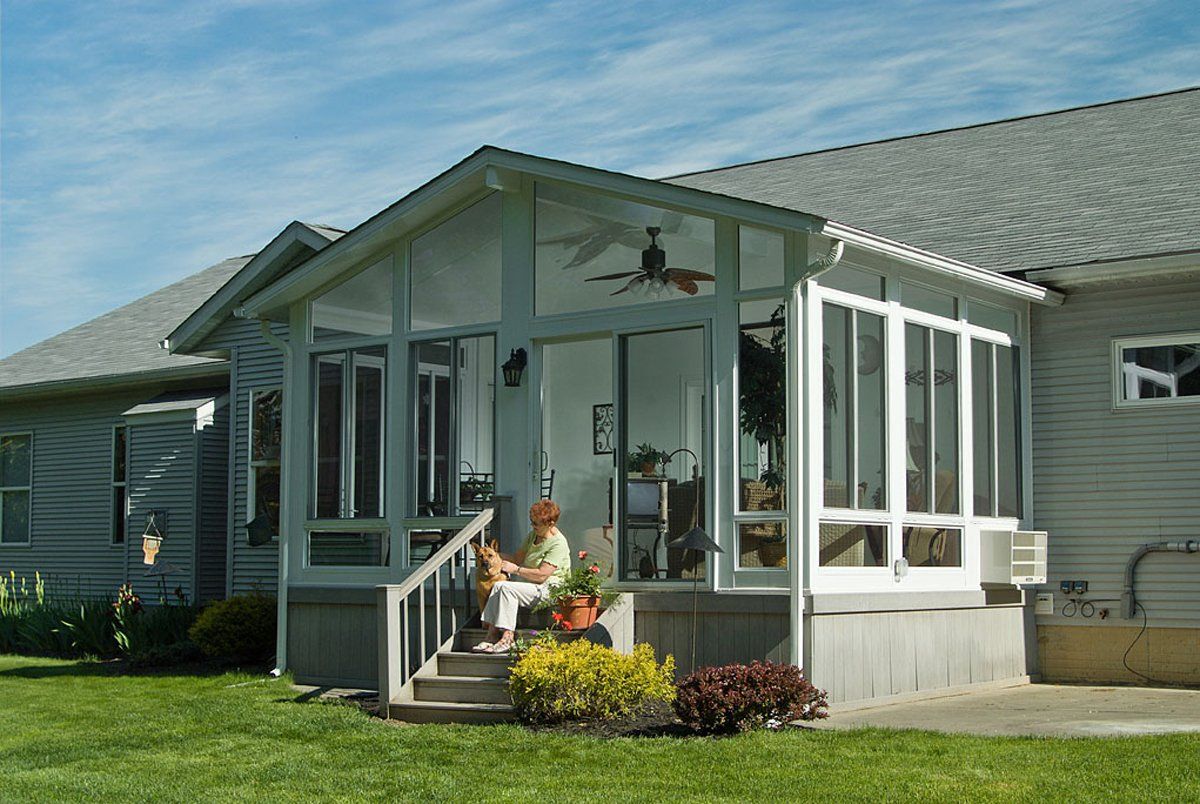 Woman and Dog Outside The House — Langhorne & Bensalem, PA — Besco Windows and Doors Inc.
