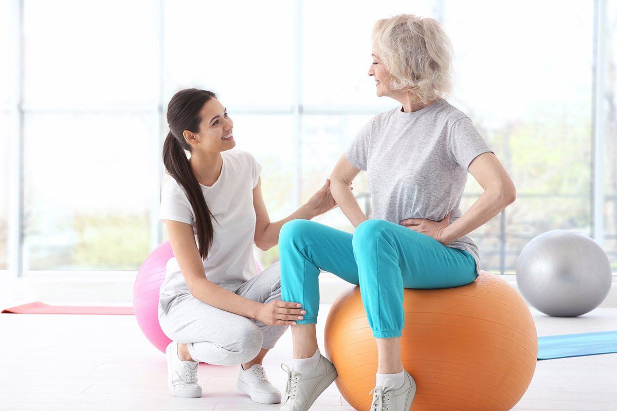 Physiotherapist Working With Elderly Patient — Physio in Port Stephens, NSW Physiotherapist Working With Elderly Patient — Physio in Port Stephens, NSW