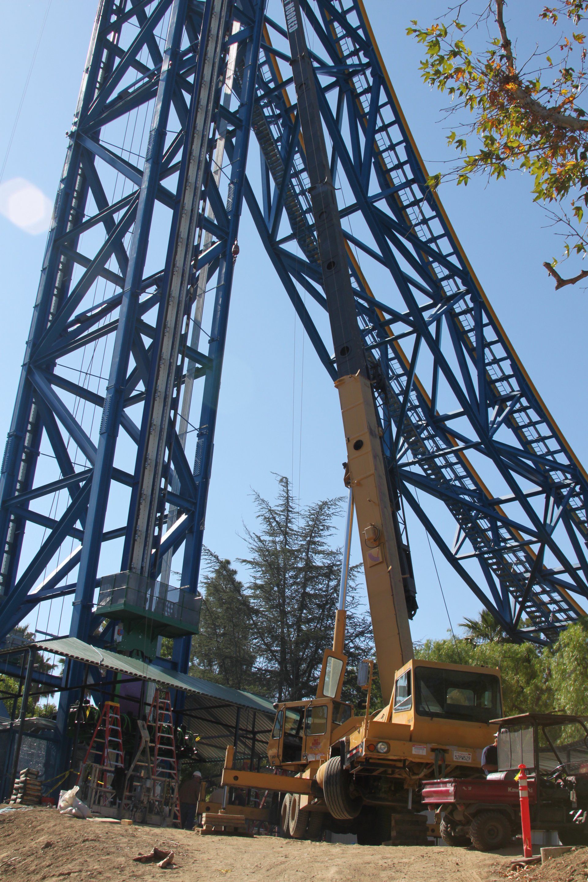 Yellow Crane Truck on Theme Park Ride — Lancaster, CA — Get Hooked Crane Service