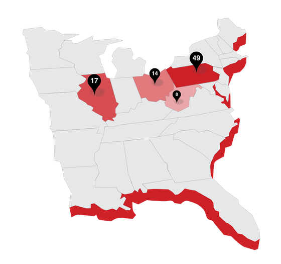 A map of the united states with red states and black pins