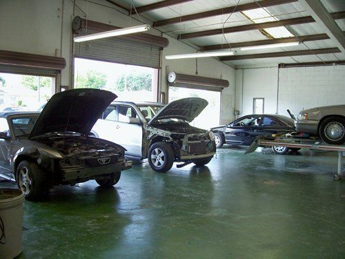 Mechanic Doing A Car Body Repair — DeSoto, TX — Escobar & Son Paint & Body Shop